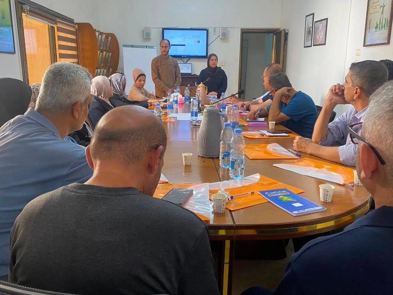A group discussion from the journalists' digital security training album, illustrating presence and digital transformation